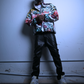 A black male model shown wearing the city chaos pullover by JCB ULTRA. He is doing a moody pose while holding his hands together with a straight face. 