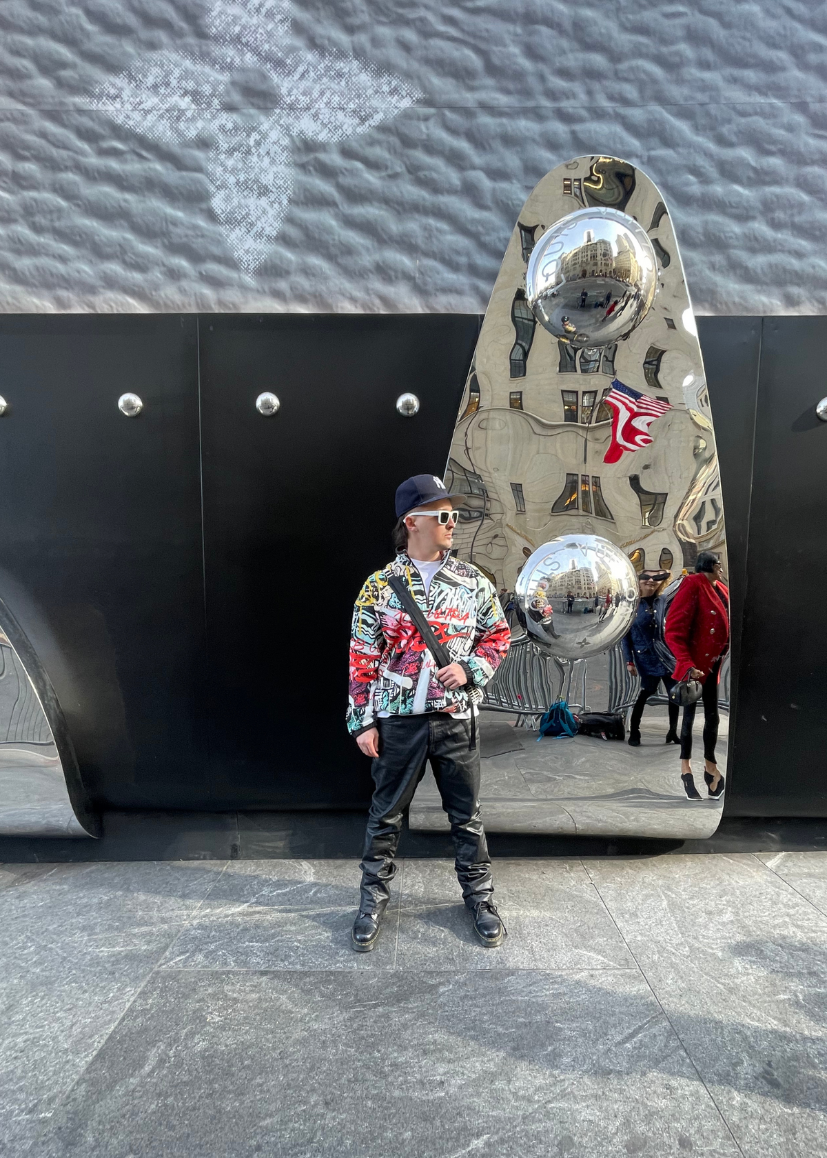 A model shown wearing JCB Ultra city chaos pullover outside - a lifestyle shot